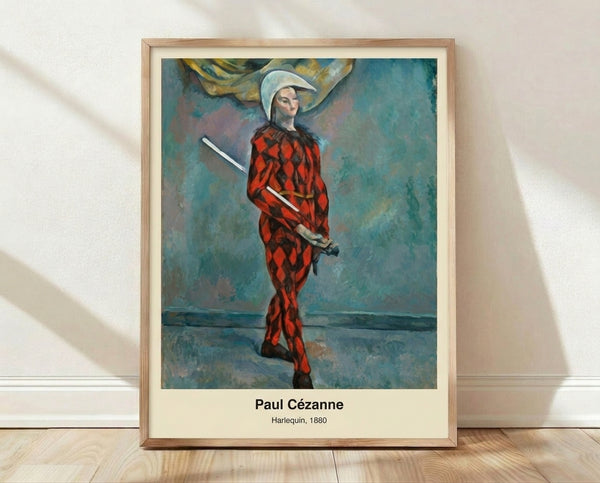 Cezanne's 1880 Harlequin painting featuring a solitary figure in ochre, blue, and red tones with an introspective, melancholic mood rendered in impressionist style.
