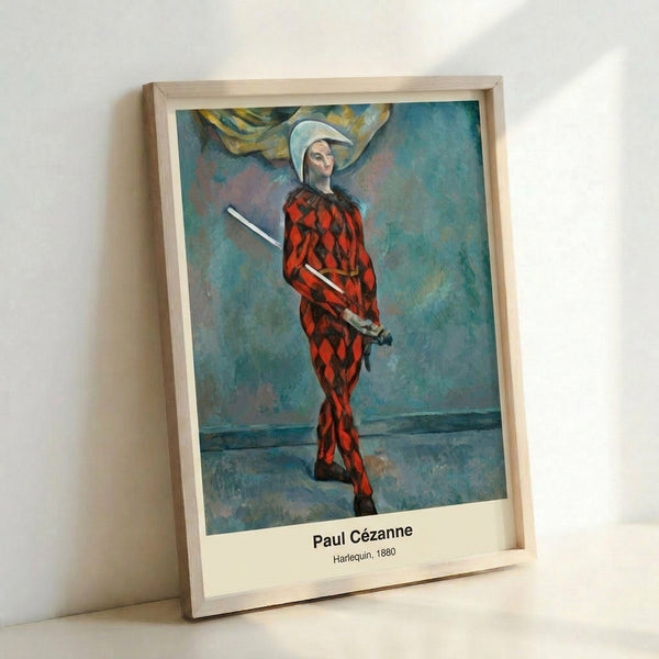 Modern art print of Cezanne's faceless harlequin figure, combining ochre, red, and cream tones in a solitary, contemplative composition.