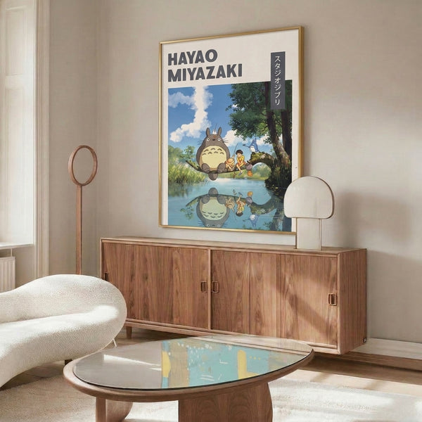 Charming framed poster capturing a moment of wonder between a child and magical forest creature beside a pond, illustrated in Ghibli's gentle style with forest green and sky blue palettes.