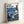Modern pop art poster blending Ghibli charm with Starry Night aesthetics: Totoro stands under an umbrella surrounded by swirling constellations, cypress silhouettes, and dreamy colors of deep blue and cream.