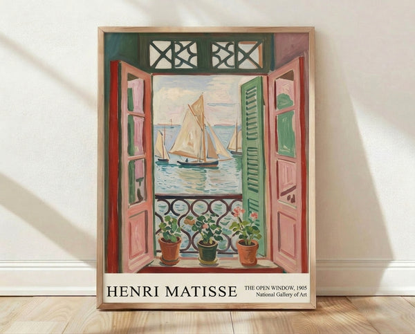 Matisse's The Open Window framed poster featuring a serene Mediterranean balcony view with coral shutters, sage green plants, and a distant sailboat on pale blue water.