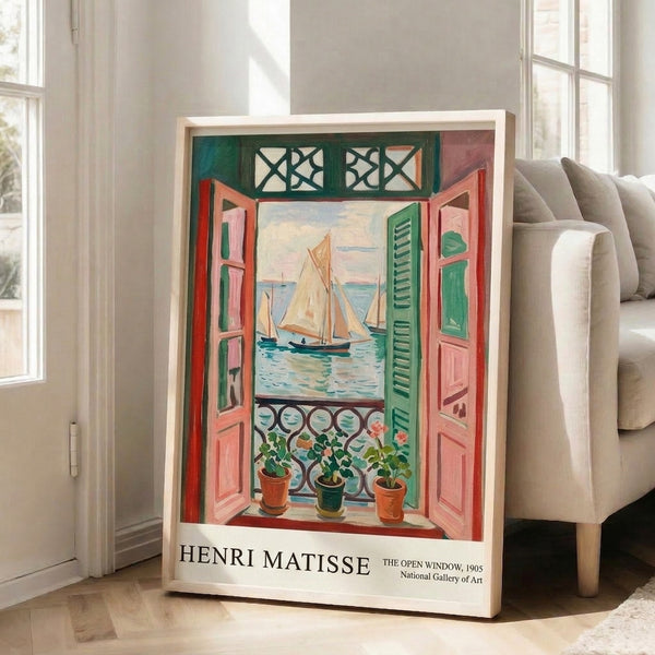 Impressionist-style framed print capturing Matisse's serene window view with cream-colored shutters, lush sage plants, and a distant sailboat on calm blue waters.