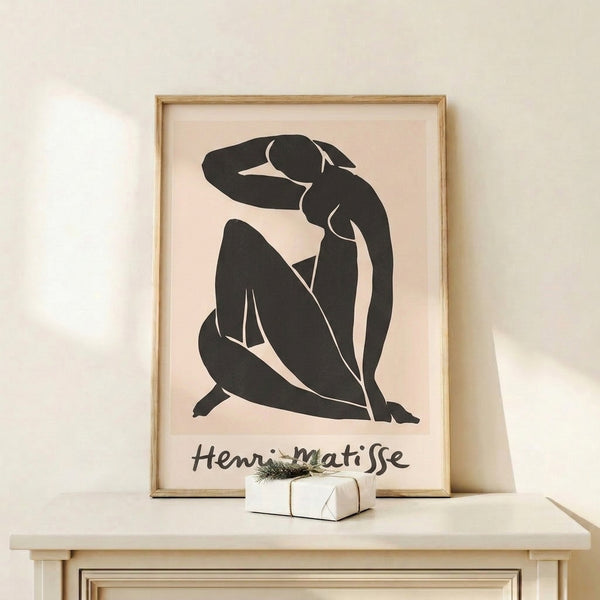 Framed wall art featuring an elegant woman's profile and form in bold black lines and negative space on a cream backdrop.