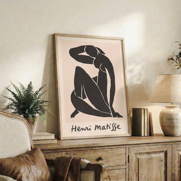 Modern line art print depicting a contemplative figure in abstract black strokes and organic shapes against a cream ground.