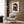 Contemporary wall art print of a seated woman in minimalist style, defined by expressive black lines and negative space on cream.