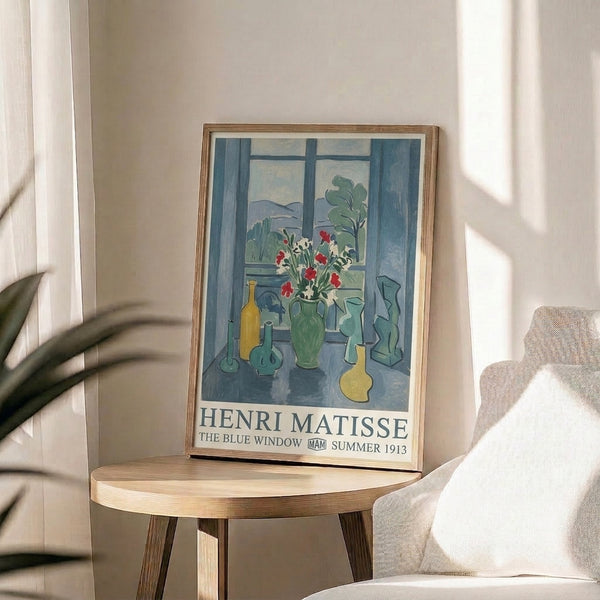 Matisse's iconic The Blue Window framed poster, a serene depiction of a domestic scene with flowers and tableware in sophisticated cool and warm color balance.