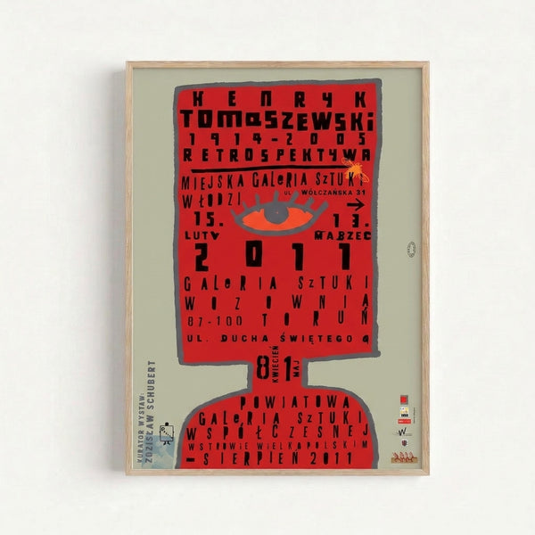 Graphic exhibition print with a commanding red eye motif and sans-serif typography against neutral tones, characteristic of modernist poster art.