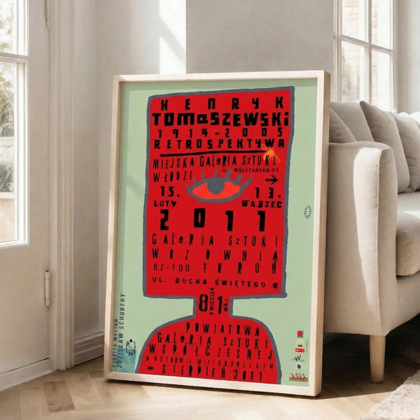 Modernist poster art featuring an intense red eye centered with geometric text elements, rendered in classic Bauhaus palette of red, black, and gray.
