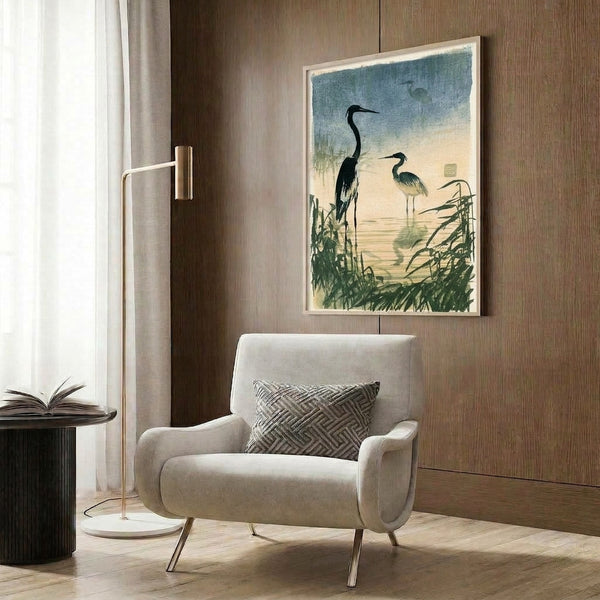 Wall-mounted art print depicting a graceful heron among aquatic plants in soft teal and cream, capturing serene marsh atmosphere through Japanese woodblock style and minimalist composition.