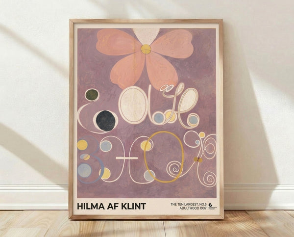 Framed abstract art print featuring organic circles and spiral motifs in mauve, peach, and cream tones, inspired by Hilma af Klint's modernist composition with a meditative and harmonious aesthetic.
