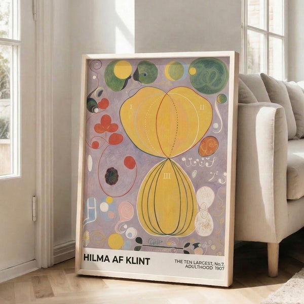Spiritual abstract poster with concentric sphere and botanical spiral imagery in pale purple, coral red, and golden yellow, presented as framed wall art in harmonious minimalist style.