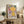 Minimalist abstract wall print featuring interconnected circles and organic spiral leaf forms in cream, sage green, coral red, and golden yellow creating contemplative sacred geometry.