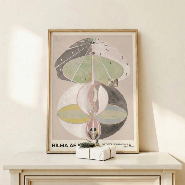 Soft-hued abstract tree artwork in mauve pink and pale yellow with geometric elements, displayed as framed wall art for serene living spaces.