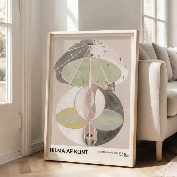 Framed abstract poster blending organic tree forms with geometric shapes in muted sage green and cream, evoking cosmic meditative energy.