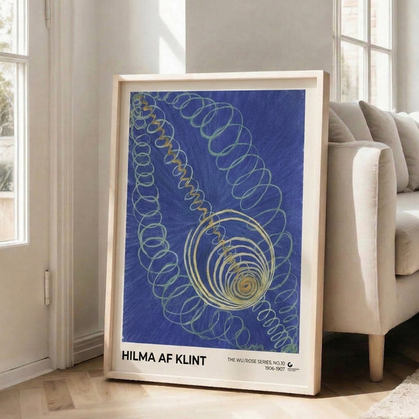 Minimalist Art Nouveau-inspired wall art featuring a symmetrical spiral pattern in deep blue with gold and soft green highlights, evoking quiet contemplation.