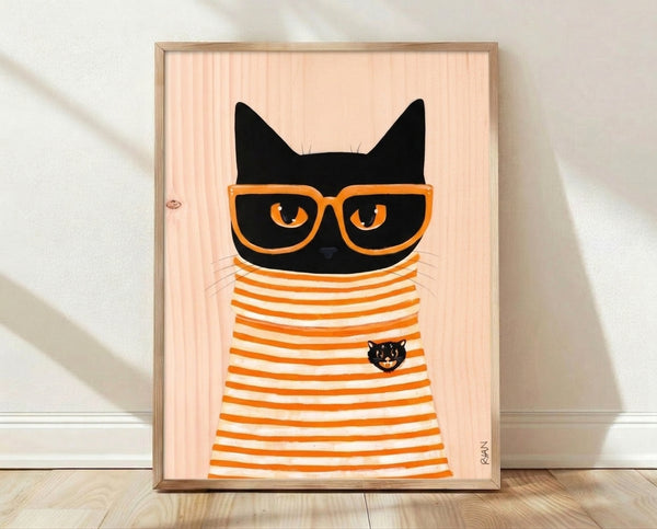 Minimalist retro art print of a black cat wearing oversized orange glasses against a cream background, framed on a wall.
