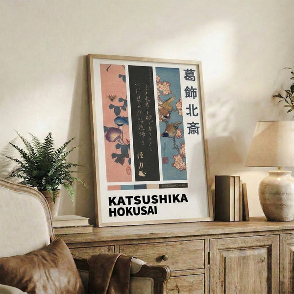 Classical Japanese poster art displaying interconnected morning glory flowers with a visiting bird, executed in soft coral pink and deep teal blue with charcoal accents.