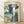 Japanese woodblock print depicting a majestic waterfall cascading down a rocky mountain, framed on a wall; serene landscape in cream, indigo, and teal tones.