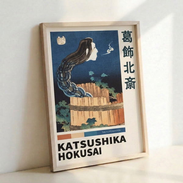 Hokusai-inspired woodblock composition showing a contemplative figure amid flowing waterfall mist and rocky terrain, printed in rich indigo and earthy hues.