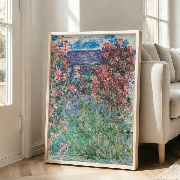 Delicate impressionist artwork featuring a cottage framed by flourishing rose gardens, composed in soft pinks, lavenders, greens, and whites that convey a calm, idyllic mood.