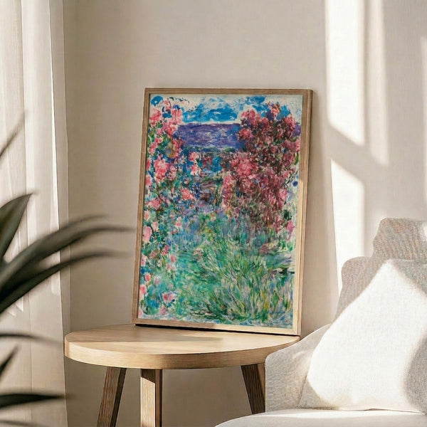 Garden art print in the impressionist tradition showing a peaceful residential dwelling surrounded by abundant blooming roses, rendered with soft focus and dreamy pastel tones.