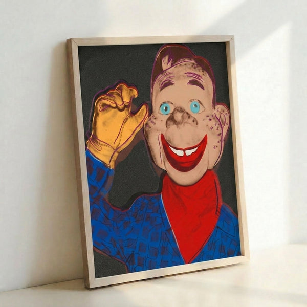 Iconic pop art print depicting a smiling figure with exaggerated features in black, red, and yellow on cream background.