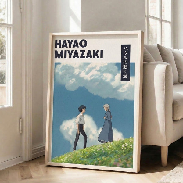 Framed poster of an ethereal hilltop scene with two figures gazing across a field toward misty mountains, featuring characteristic Ghibli aesthetic in calming blues, greens, and soft whites.