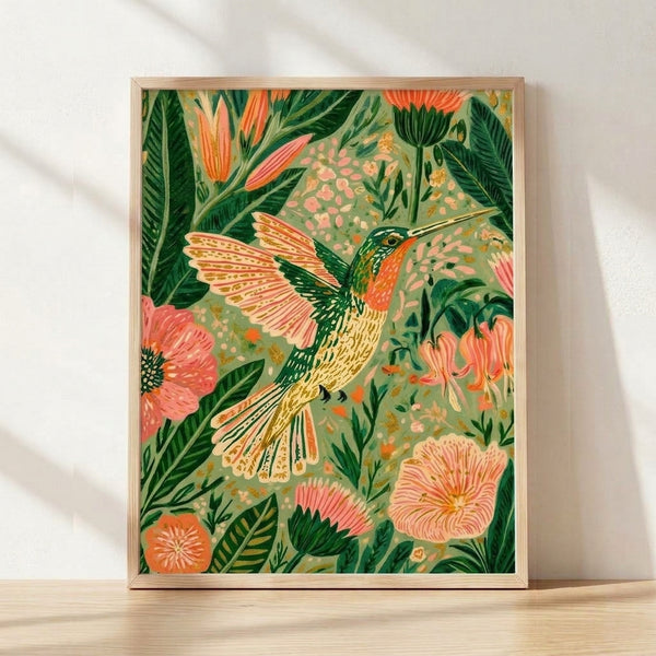 Watercolor hummingbird hovering among sage green and coral pink flowers with gold accents in a boho botanical composition, framed as wall art.