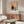 Contemporary abstract poster with layered circles in warm terracotta and cool sage tones against a cream background, symbolizing the intersection of purpose and mindfulness.