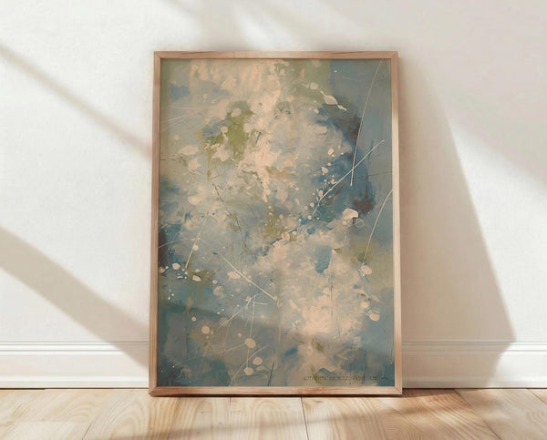 May include: Framed abstract expressionist artwork with soft blue, green, and cream watercolor washes, delicate line work, and white circular dots scattered throughout. The piece is displayed in a light wood frame, leaning against a white textured wall on blonde hardwood flooring with natural sunlight casting gentle shadows across the scene.