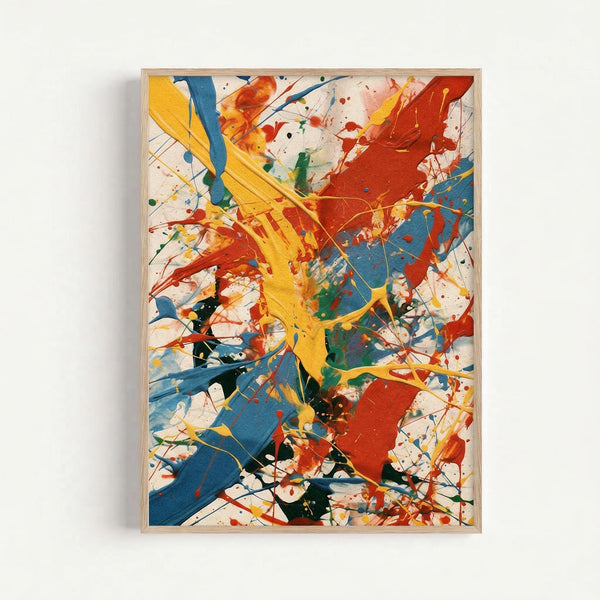 Abstract expressionist artwork with dynamic paint splatters and gestural brushstrokes in vibrant yellow, red, blue, green, and black on white background. Bold intersecting lines and drips create energetic movement across the composition. Displayed in simple light wood frame against white wall.