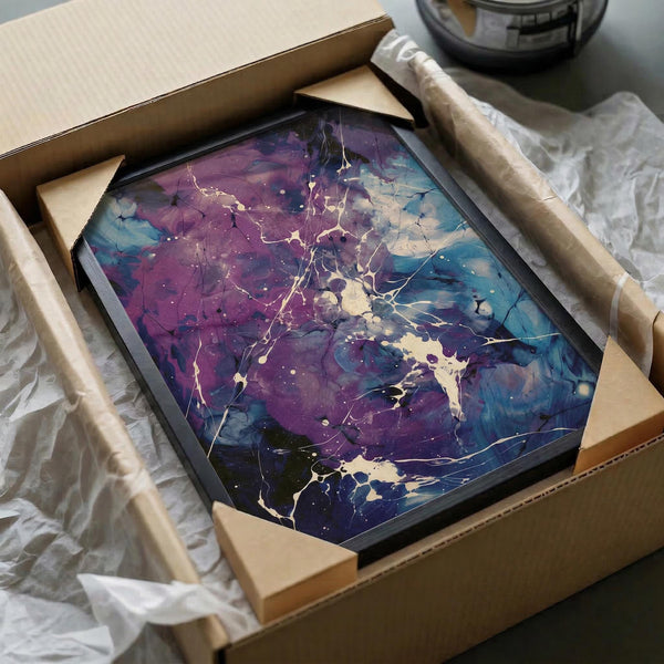 May include: Abstract artwork with purple and blue fluid paint splatters and white lightning-like cracks, displayed in black hexagonal frame inside cardboard shipping box with protective tissue paper and cardboard corners, alongside tape roll on white surface