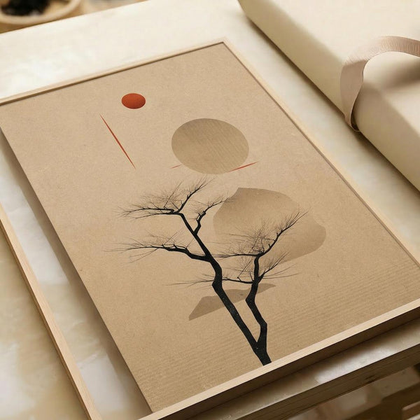 May include: Minimalist art print displayed in an open book or portfolio, featuring a bare black tree silhouette against a warm beige background with geometric shapes - a small red-orange circle, thin red lines, and soft brown oval forms suggesting sun and abstract elements. The print has a clean modern aesthetic with neutral earth tones.