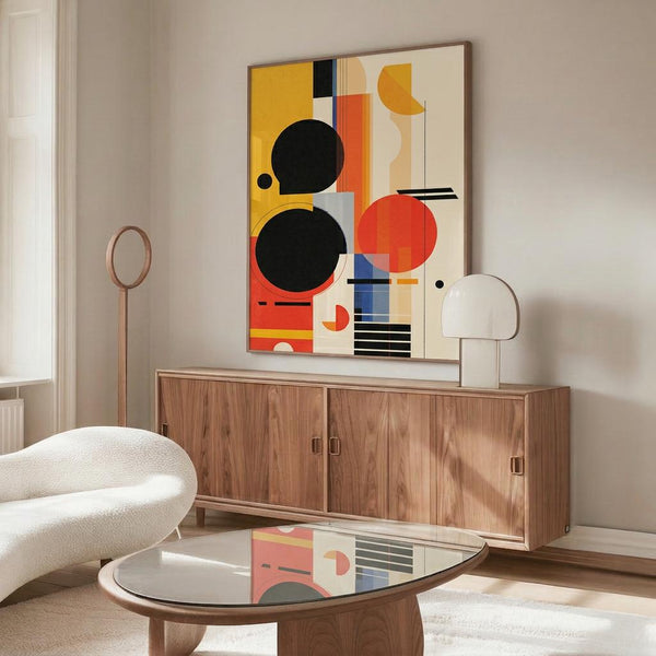 May include: Abstract geometric poster with colorful circles, rectangles and lines in yellow, orange, red, black and blue displayed above a wooden sideboard in a modern living room with white curved chair, round glass coffee table, and mushroom-style table lamp creating warm natural lighting