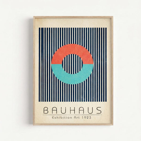 May include: Framed vintage-style Bauhaus art print hanging on white wall. Features bold navy blue vertical stripes with coral orange and teal blue circle in center. Cream background with "BAUHAUS Exhibition Art 1923" text below geometric design. Light wood frame with clean modern aesthetic.