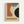 Framed vintage-style poster with geometric abstract design featuring curved and angular shapes in terracotta orange, slate blue, cream, and black on textured beige background. Date "JUNE 17, 1921" appears in upper left, "BAUHAUS" text in yellow banner at bottom. Light wood frame mounted on white wall.