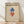 May include: Framed Bauhaus-style poster with geometric diamond shapes in blue and red on cream background, displayed against white wall on light wood floor. Features vintage typography and minimalist design aesthetic typical of 1919 Weimar art movement.