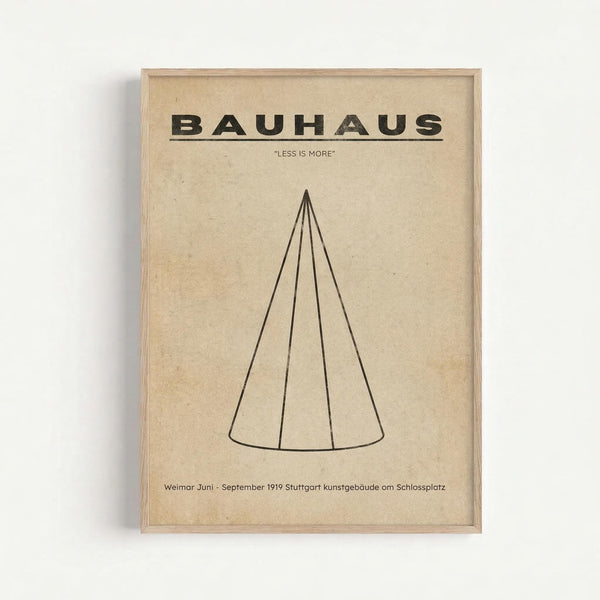 Minimalist beige poster with black text reading "BAUHAUS" and "LESS IS MORE" at top, featuring a simple line drawing of a cone shape in the center. Small German text at bottom references Weimar and Stuttgart 1919. Displayed in light wood frame against white wall with visible shadow.