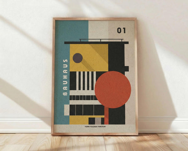 May include: Framed Bauhaus-style geometric poster with abstract architectural elements in yellow, teal, orange, and black colors, featuring circles, rectangles, and linear patterns. The print displays "01" and "BAUHAUS" text with "FORM FOLLOWS FUNCTION" at bottom. Natural wood frame sits on light wooden floor against white wall with soft shadows.
