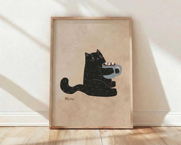 May include: Framed poster print leaning against white wall on wooden floor with natural light shadows. Features cute black cat illustration holding gray coffee mug with pink marshmallows on beige textured background. Word "Meow" appears below cat. Light wood frame, minimalist room setting with white baseboard trim.
