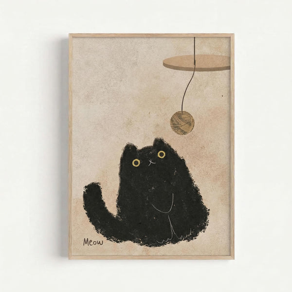 A minimalist illustration of a black cat with yellow eyes sitting upright, looking up at a ball of yarn dangling from a wooden platform above. The cat has a textured, sketchy appearance against a beige background. "Meow" is written in small text at the bottom left. The artwork is displayed in a light wood frame on a white wall.