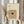 May include: Person in cream-colored top holding framed espresso martini cocktail recipe poster while holding dried pampas grass. The vintage-style print features a dark coffee cocktail in a martini glass with ingredient list on cream background. Light wooden frame against neutral wall with soft natural lighting.