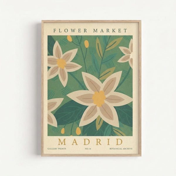 Vintage-style botanical poster featuring white flowers with yellow centers and brown-toned petals against a green leafy background. The artwork has "FLOWER MARKET" at top and "MADRID" at bottom in serif lettering, with "GALLERY PRINTS", "NO.14" and "BOTANICAL ARCHIVE" in smaller text below. Displayed in a light wood frame against a white wall, showing the cream-colored border around the central floral illustration.