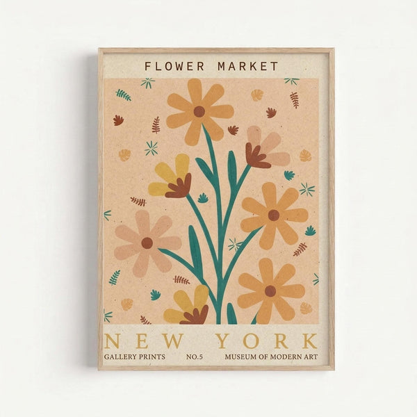 A framed vintage-style botanical poster featuring stylized flowers in warm earth tones including orange, yellow, pink, and teal against a cream background. The artwork shows daisy-like blooms on green stems with scattered leaves and small botanical elements throughout. Text reads "FLOWER MARKET" at top and "NEW YORK" at bottom with "GALLERY PRINTS NO.5 MUSEUM OF MODERN ART" in smaller text. The print is displayed in a light wood frame against a white wall.