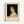 May include: Framed art print poster featuring a classical portrait painting of a young woman with curly brown hair wearing a white ruffled dress against dark background. Text below reads "PIERRE AUGUSTE exhibition" with "Gabrielle Cot" and "Pierre Auguste's Daughter" in smaller print. Light wood frame with cream matting displayed on white wall.