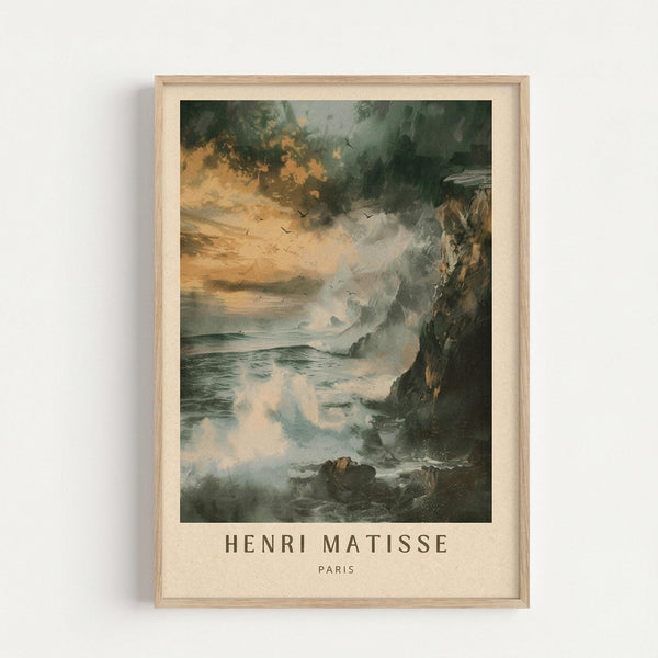 May include: Framed art print showing a dramatic coastal seascape with stormy skies, rocky cliffs, and turbulent ocean waves. The painting features moody green and orange tones with flying birds silhouetted against cloudy skies. Text reading "HENRI MATISSE PARIS" appears below the artwork. The print is displayed in a light wood frame against a white wall, showing romantic landscape painting style with atmospheric lighting and natural textures.