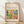 May include: Framed art poster featuring a vibrant Matisse-style landscape with colorful trees, foliage and abstract forms in yellows, greens, purples and oranges. The cream-colored poster has "ART POSTER" at top, "DISCOVER THE BEAUTY OF MATISSE'S ART" as main text, and "MODERN HOME DECOR" at bottom. Natural wood frame sits against white textured wall on light wooden flooring with soft shadows.