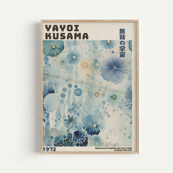 Framed exhibition poster featuring abstract blue and teal floral patterns with radiating flower-like shapes, circles, and dots in watercolor style. The artwork displays "YAYOI KUSAMA" at the top, "1972" at bottom left, and "MUSEUM OF MODERN ART NEW YORK EXHIBITION ART" at bottom right, with vertical Japanese text on the right side. Light wooden frame against white wall background.