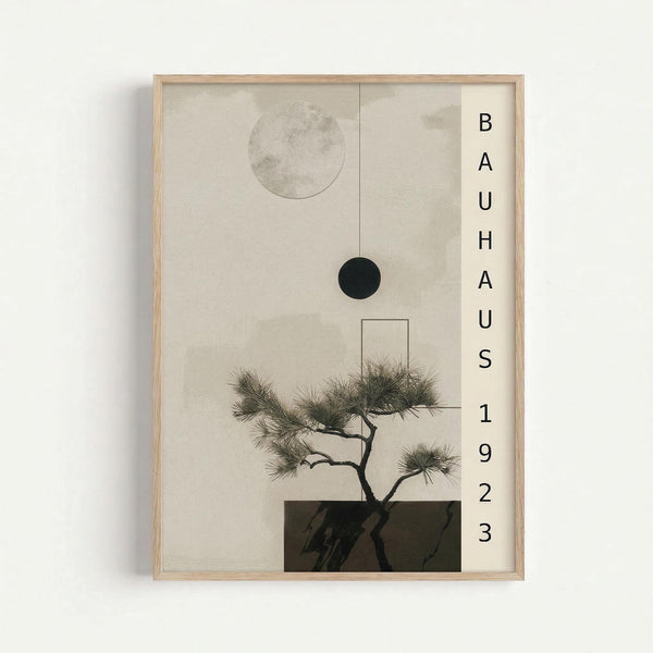 Minimalist art print in light wood frame featuring a bonsai tree with delicate pine needles growing from a dark rectangular base. Above the tree are two circles - one light gray and one solid black - creating celestial elements against the neutral beige background. Text reading "BAUHAUS 1923" appears vertically on the right side. The composition has a zen-like, modernist aesthetic with clean geometric shapes and natural organic forms.