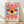 May include: Framed poster with geometric Bauhaus-style design featuring a large stylized eye with yellow iris, dark blue pupil, and white highlight, surrounded by blue rectangular background. Red and white radiating sunburst rays extend above and below the eye. Text at bottom reads "BAUHAUS 1919-1933 SCHOOL OF ARTS & CRAFTS". Natural wood frame sits on light wooden floor against white wall with soft shadows.